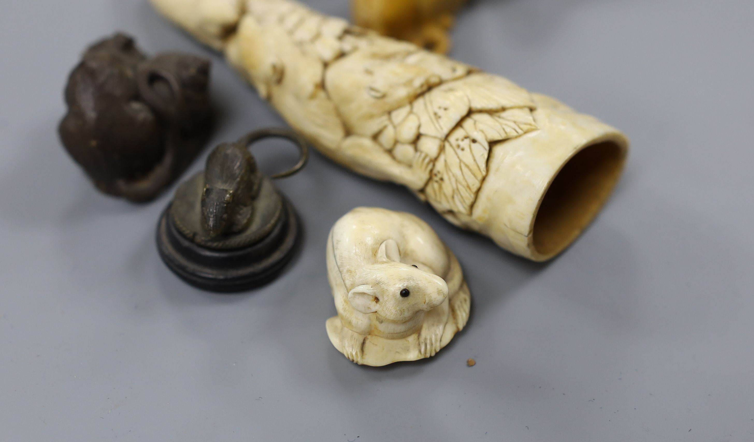 A collection of Japanese ivory and wood netsuke and okimono